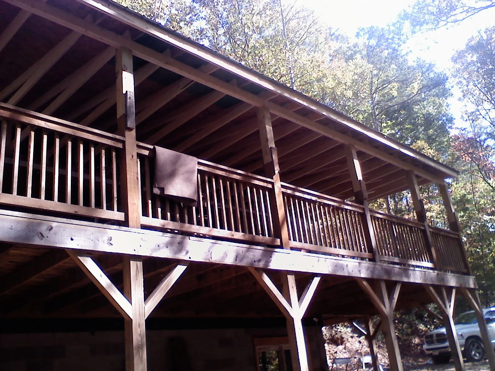 Timber framing under a new elevated porch and deck — Roof Leak Repair in Maynard by Roofing Brothers